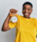 ClearLift | A smiling woman holding an alarm clock