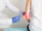 Ozone Therapy | A doctor injects treatment near his patient's elbow.