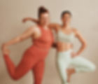 Exilis Treatment | A pair of beautiful women doing yoga poses together